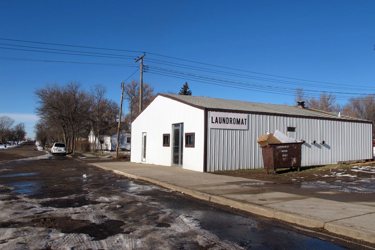 This laundromat located in Pashall, N.D, is near the location where a New Town, N.D., man killed himself with a knife Sunday, Nov. 18, 2012. The man is considered a person of interest in the Sunday shooting death of a woman and three of her granchildren in New Town, N.D., on an American Indian reservation called Fort Berthold. Martha Johnson, 64, and three of her grandchildren were gunned down in the home Sunday afternoon. (Lauren Donovan / The Bismarck Tribune)
