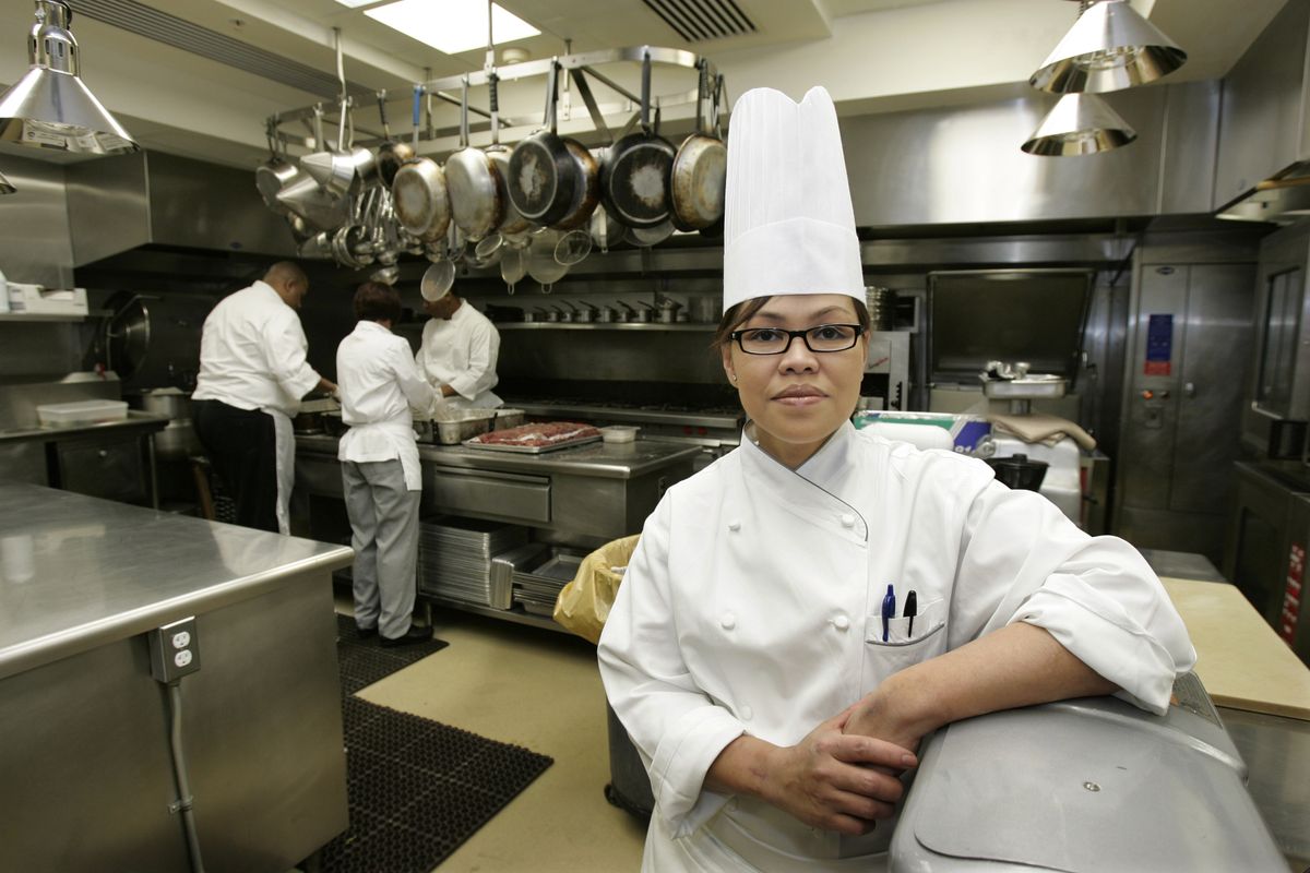 White House chef Cristeta Comerford pauses during preparation for a meal in the White House kitchen. Associated Press photos (Associated Press photos / The Spokesman-Review)