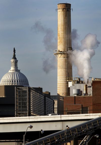 Steam rises last week from Washington’s Capitol Power Plant, which heats and cools the halls of Congress.  (Associated Press / The Spokesman-Review)