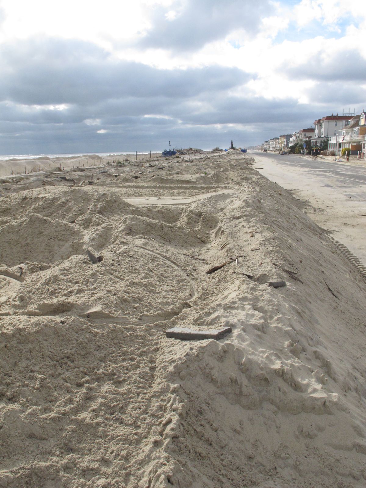 Piles of sand are all that remain where the Belmar N.J. boardwalk used to stand, in a Nov. 15, 2012 photo. Superstorm Sandy took a bite out of the Jersey shore, washing away millions of tons of sand and slimming down beaches along the state�s 127-mile coastline. (Wayne Parry / Associated Press)
