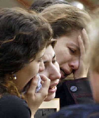 
Lika, center, wife of Moscow businessman Tengiz Yakobashvili, cries at her husband's funeral in Moscow on Friday. Yakobashvili died in one of Tuesday's two nearly simultaneous plane crashes that killed 90 people.
 (Associated Press / The Spokesman-Review)