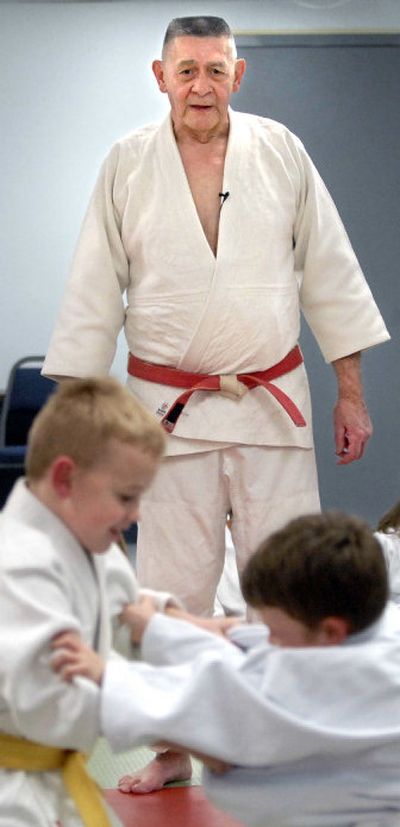 
Pacific Judo Academy Sensei Bob Harder watches as 6-year-old Elias Newton, left, and 8-year-old Sipriano Barrera test their judo techniques at practice last Thursday. A well-respected judo instructor,  Harder has been instrumental in bringing the Regional Judo Competition to Spokane on Saturday.
 (Holly Pickett / The Spokesman-Review)