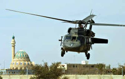 
A U.S. military helicopter flies over Tikrit, Iraq, on Saturday.
 (Associated Press / The Spokesman-Review)