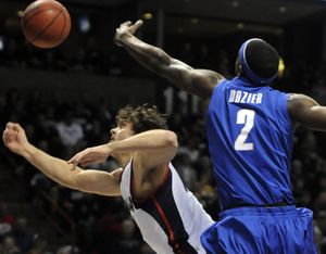 Gonzaga's Matt Bouldin has his shot rejected by Memphis forward Robert Dozier in the opening moments of the game, February 7, 2009, in the Spokane Arena. (Dan Pelle / The Spokesman-Review)
