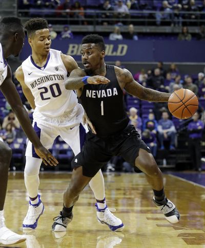 Nevada's Marcus Marshall, right, tries to get past Washington's Markelle Fultz in the first half of an NCAA college basketball game Sunday, Dec. 11, 2016, in Seattle. (Elaine Thompson / Associated Press)