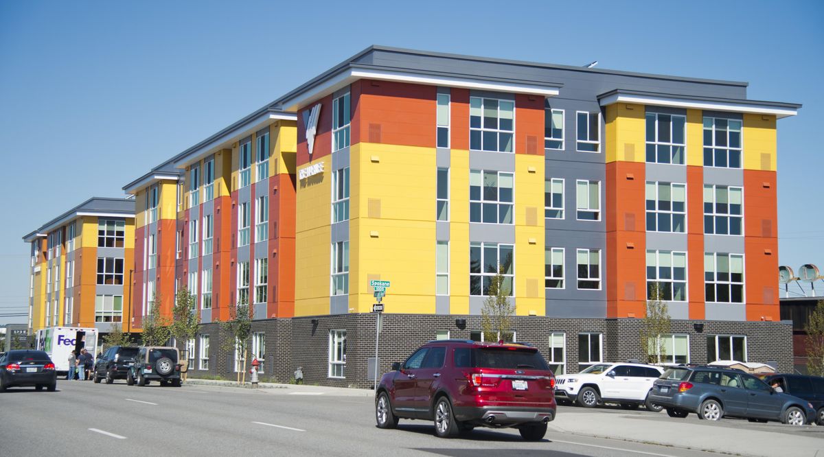 The two new, brightly-colored apartment buildings built by Catholic Charities and Volunteers of America with help from Spokane City and County are called Buder Haven and The Marilee, shown during the grand opening Thursday, July 28, 2016. The two buildings, on the 200 block of E. 2nd Ave., have 100 one-bedroom and studio units specifically to house the chronically homeless. (Jesse Tinsley / The Spokesman-Review)