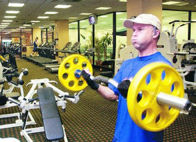 
Researchers say pumping iron helps increase a person's metabolic rate, causing the body to burn calories faster.
 (FILE Associated Press / The Spokesman-Review)