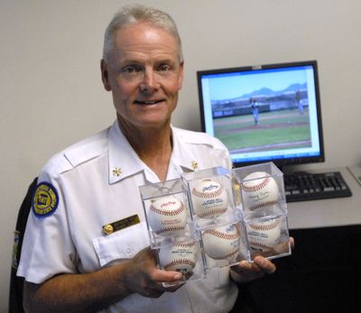 Randy Olson, the EMS battalion chief for the Spokane Valley Fire Department, is a star in the Men’s Senior Baseball League.  A lifelong baseball fan, he also collects balls, baseball cards and other memorablia.  (J. BART RAYNIAK / The Spokesman-Review)