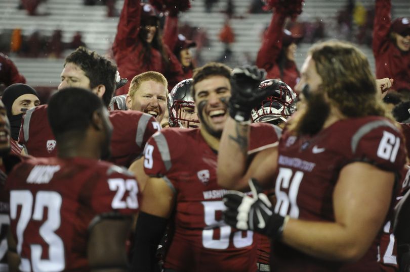 WSU celebrates after defeating UCLA during the second half of a Pac-12 college football game on Saturday, Oct. 15, 2016, Martin Stadium in Pullman. WSU won the game 27-21. (Tyler Tjomsland / The Spokesman-Review)