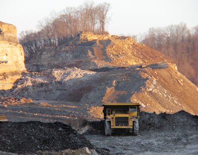 A dump truck moves dirt and rock from a mountaintop removal coal mine near Hazard, Ky., in December  2005. The Environmental Protection Agency is giving 79 mountaintop removal applications closer scrutiny.  (File Associated Press / The Spokesman-Review)