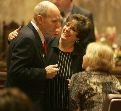 
Sen. Bob Oke, R-Port Orchard, left, who is battling cancer, is congratulated by Sens. Tracey Eide, D-Federal Way, center, and Lisa Brown, D-Spokane. A bill he sponsored, which prevents free handouts of tobacco products, passed a House vote on Friday 73 to 25 after five years of trying. Oke's cancer is unrelated to smoking. 
 (ROBERT SUMNER Special to / The Spokesman-Review)