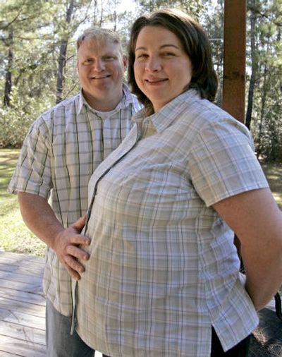 
Glen and Rebekah Markham pose in their backyard in Covington, La. The rescue of more than 1,400 embryos from a flooded clinic two weeks after Hurricane Katrina gave the Markham family plan new life. 
 (Associated Press / The Spokesman-Review)