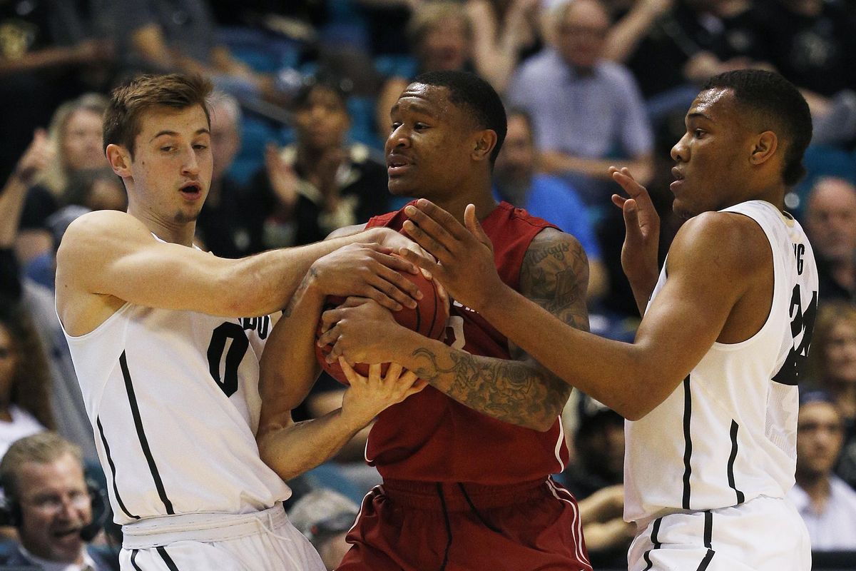 Colorado guard Thomas Akyazili, left, Washington State guard Charles Callison, center, and Colorado guard George King battle for the ball during the first half of an NCAA college basketball game in the first round of the Pac-12 tournament Wednesday, March 9, 2016, in Las Vegas. (John Locher / Associated Press)