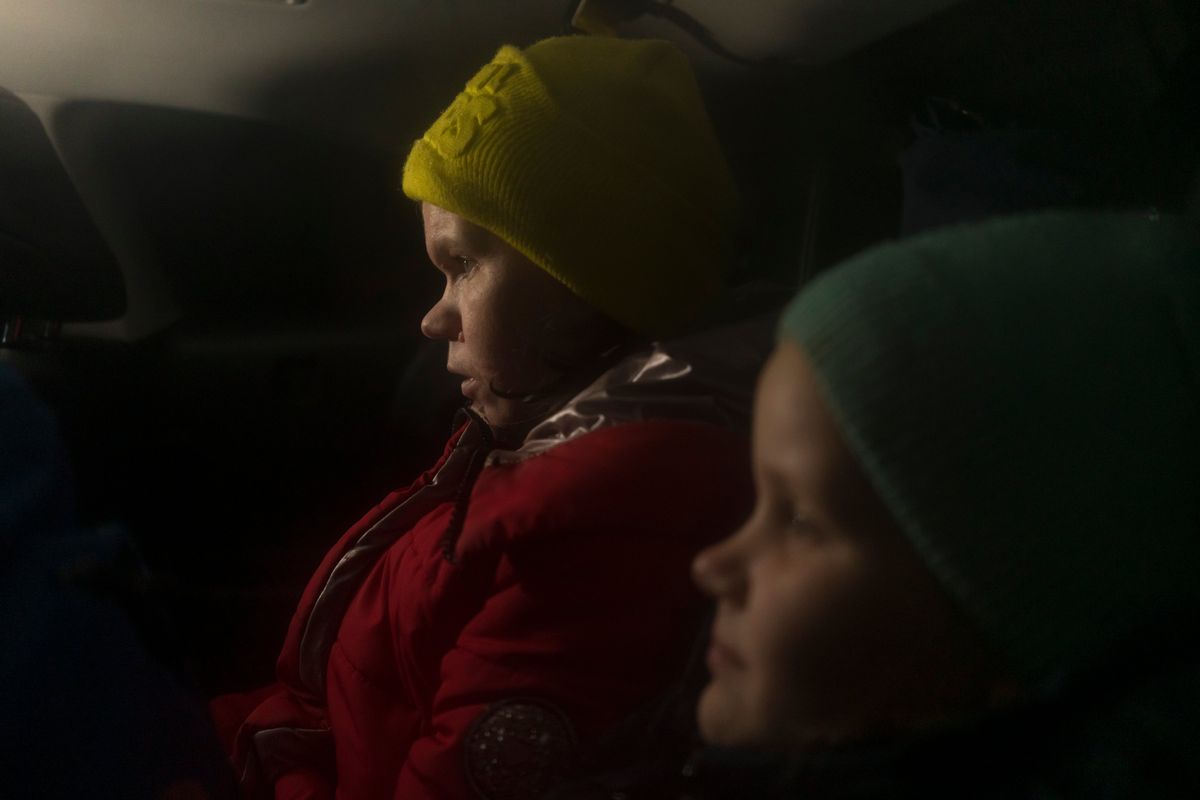 Veronika Tsymbolar, and her daughter, Marharyta Matiunina, who had been missing before the group Save Ukraine located her in Feodosiya, a resort town in Crimea, sit together in the back seat of a car in Kyiv, Ukraine on Feb. 2, 2023. Tsymbolar believes her daughter's abduction was part of a larger Russian campaign to brainwash children and wipe out Ukrainian identity.    (Brendan Hoffman/The New York Times)
