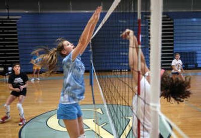 
Central Valley junior Emily Sarff, left, leaps for a block during Bears volleyball practice  Aug. 29. 
 (Holly Pickett / The Spokesman-Review)