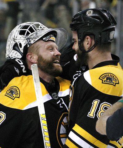 Bruins goalie Tim Thomas, left, and Nathan Horton celebrate after beating Lightning in Game 7 to advance to Stanley Cup finals. (Associated Press)