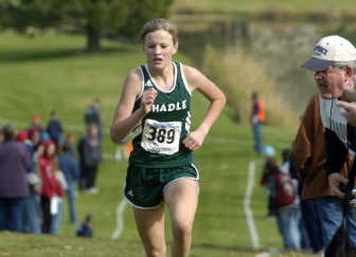 Shadle Park's Andrea Nelson climbs the last hill before finishing in first place of the 4A girls regional cross country race at Wandermere Golf Course.
(Dan Pelle / The Spokesman-Review)