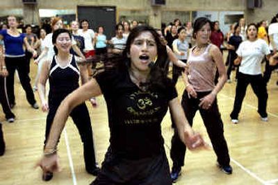 
Sheila Jain teaches Masala Bhangra Workout at her popular University of California-Berkeley session.
 (Knight Ridder / The Spokesman-Review)