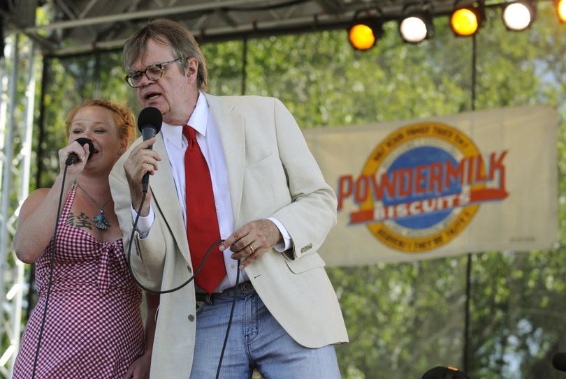 In this July 4, 2009, AP file photo, Andra Suchy and Garrison Keillor sing 