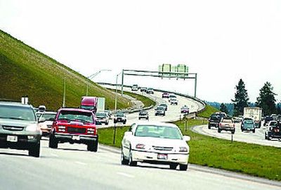 
Traffic moves at rush hour on Interstate 90 near the Highway 41 interchange  in Post Falls. 
 (Jesse Tinsley / The Spokesman-Review)
