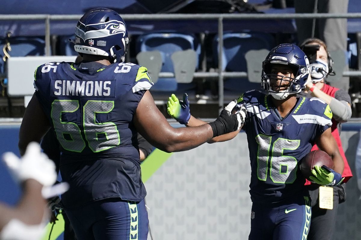 Seahawks wide receiver Tyler Lockett, right, has 24 receptions for 259 yards and four touchdowns this season.  (Elaine Thompson)