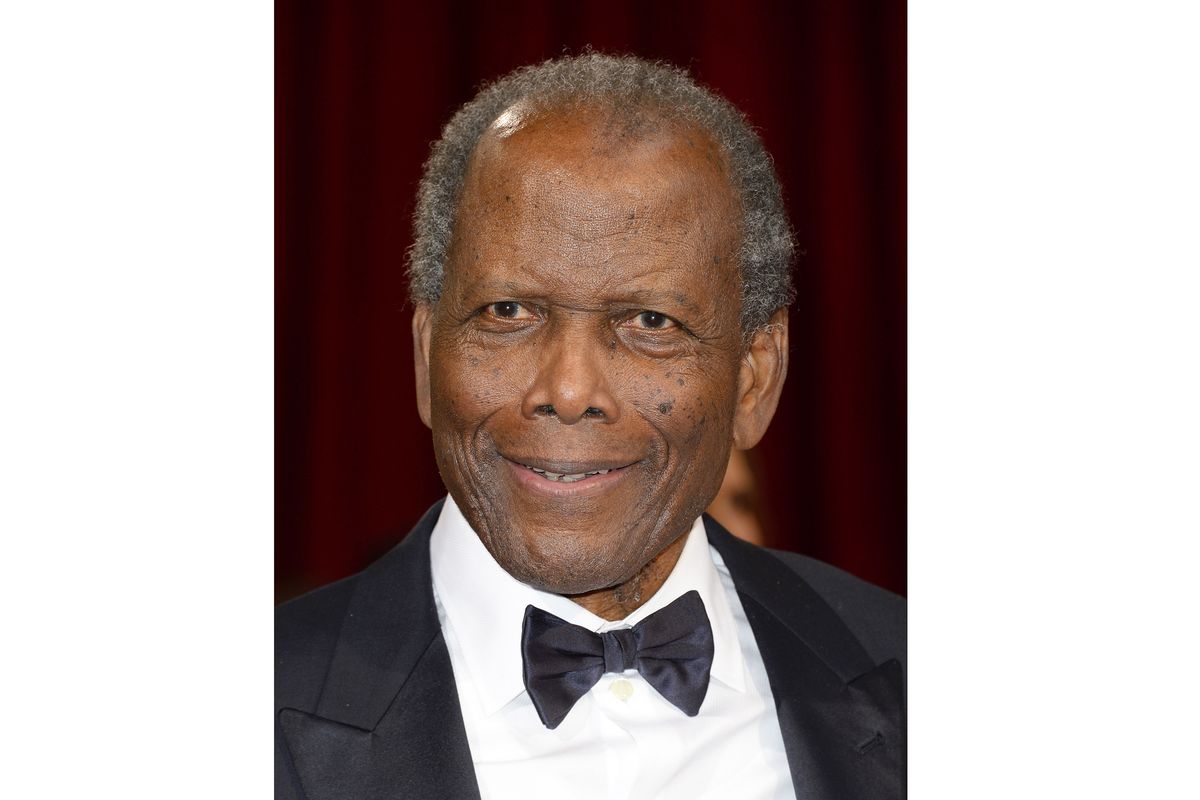 Actor Sidney Poitier arrives at the Oscars in Los Angeles on March 2, 2014. Arizona State University has named its new film school after Poitier. The university, which is expanding its existing film program into its own school, says it has invested millions of dollars in technology to create one of the largest, most accessible and most diverse film schools. The Sidney Poitier New American Film School will be unveiled at a ceremony on Monday, Jan. 25, 2021.  (Dan Steinberg)