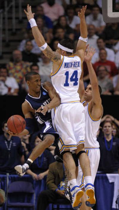 
UCLA's Lorenzo Mata-Real makes things tough for Xavier's Stanley Burrell. Associated Press
 (Associated Press / The Spokesman-Review)