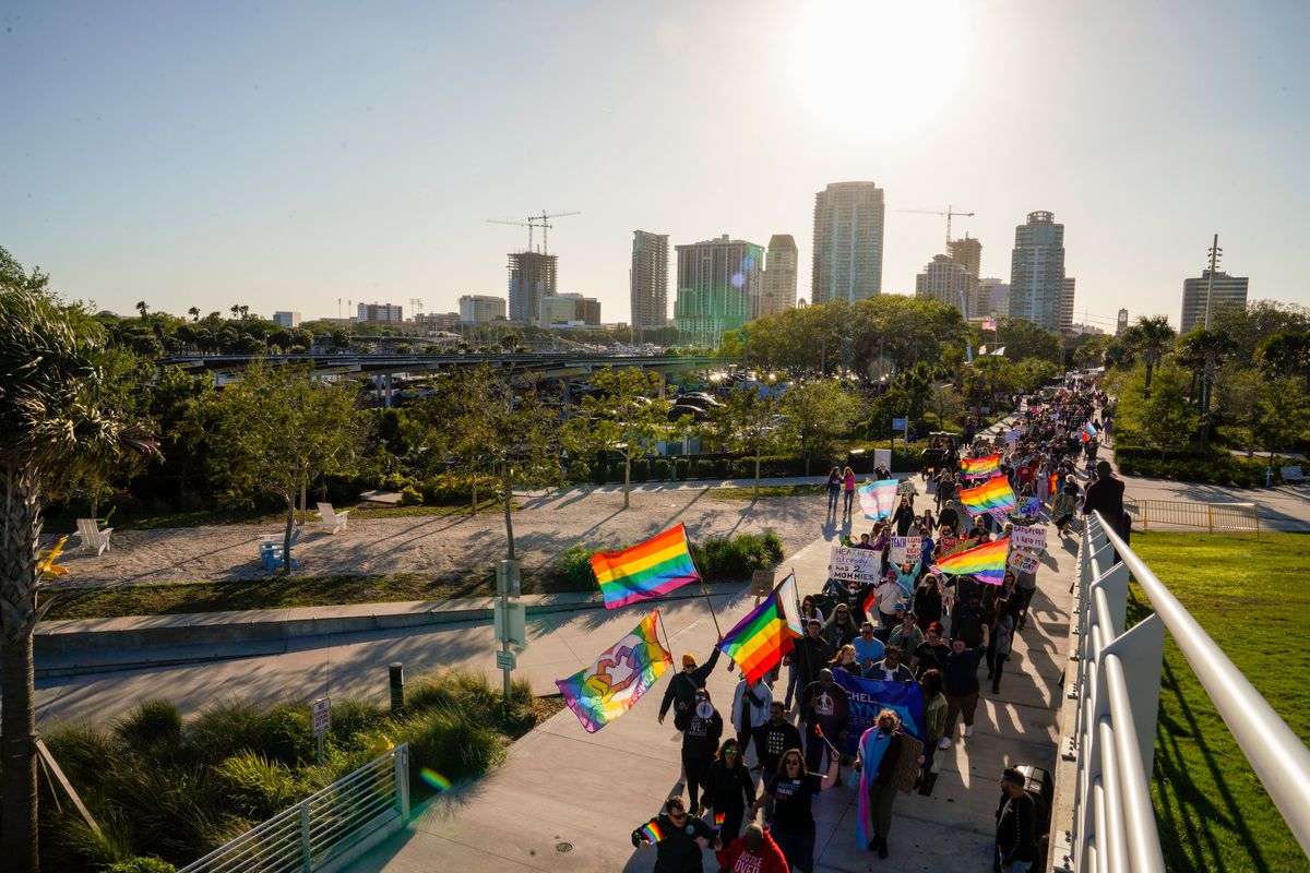 Marchers make their way toward the St. Pete Pier in St. Petersburg, Fla., on Saturday, March 12, 2022 during a march to protest the controversial "Don