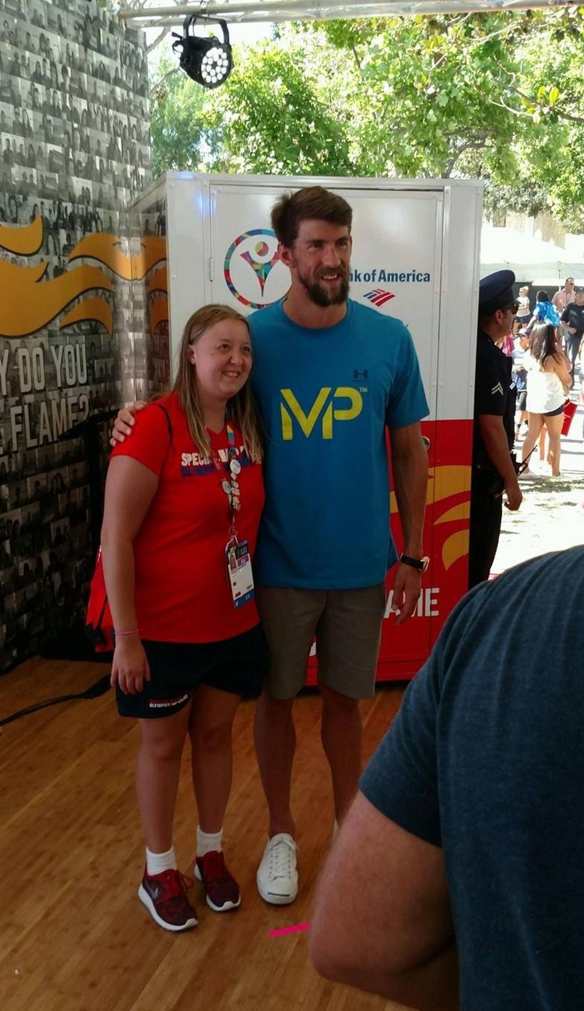Kamilah Williamson, winner of three gold medals at the Special Olympics’ World Games in Los Angeles, poses with U.S. Olympic swim multigold medalist Michael Phelps.