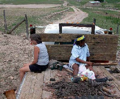 
Nancy Spada, left, of Hauser hitches a ride on a Tarahumara log truck in search of handcrafted items in Mexico. 
 (Photo courtesy of Roger Gee / The Spokesman-Review)