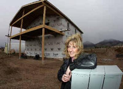 
Liz Lippitt and her husband, Tom, bought about nine acres in the rolling hills of western Colorado, but construction of their dream home is on hold until they know whether natural gas wells will be drilled on or near their land. 
 (Associated Press / The Spokesman-Review)