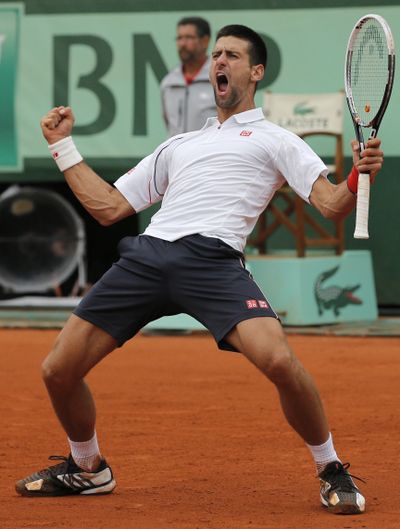 Novak Djokovic overcame four match points to beat Jo-Wilfried Tsonga in five sets. (Associated Press)