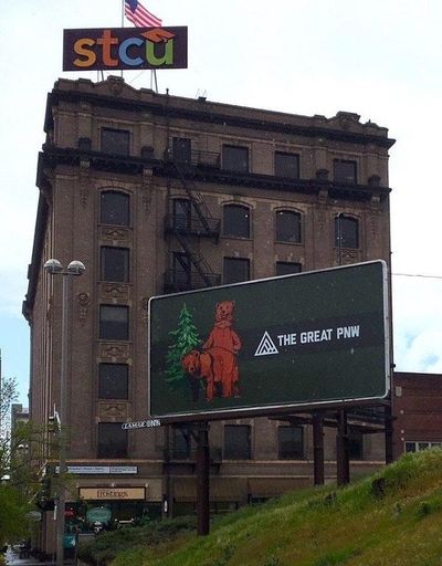 A billboard for The Great PNW clothing company depicting two bears copulating was briefly displayed in downtown Spokane Monday before being removed. (Courtesy)