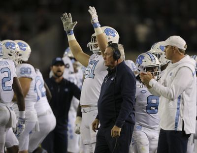 North Carolina coach Mack Brown watches after his squad made a field goal in overtime against Virginia Tech during an NCAA college football game Saturday, Oct. 19, 2019, in Blacksburg, Va. (Matt Gentry / Roanoke Times via AP)