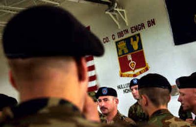 
Idaho National Guardsman Sgt. 1st Class Erckenbrack explains the conditions that the Guard unit expects at Fort Bliss, Texas. He refused to give his first name. 
 (Brian Plonka / The Spokesman-Review)