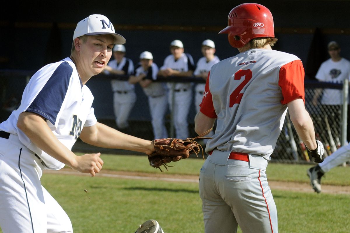 Mead’s  Kramer Kembel tags out Ferris’ Travis Key between third base and home in the second inning. (Colin Mulvany)