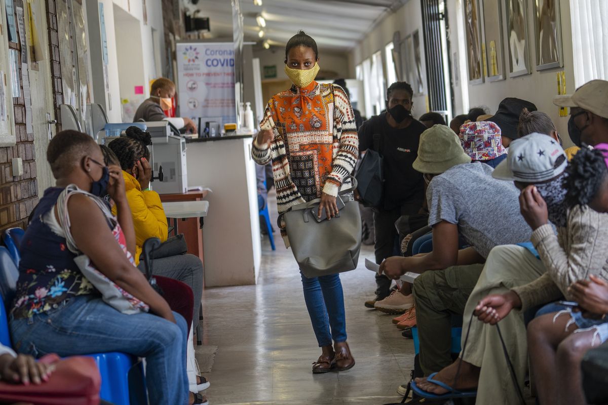 Volunteers wait to be checked at a vaccine trial facility in November at Soweto’s Chris Sani Baragwanath Hospital outside Johannesburg, South Africa.  (Jerome Delay)