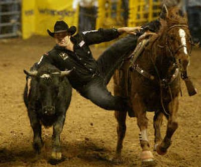 
Overall champ Luke Branquihno earned the world title in steer wrestling on Sunday.
 (Associated Press / The Spokesman-Review)