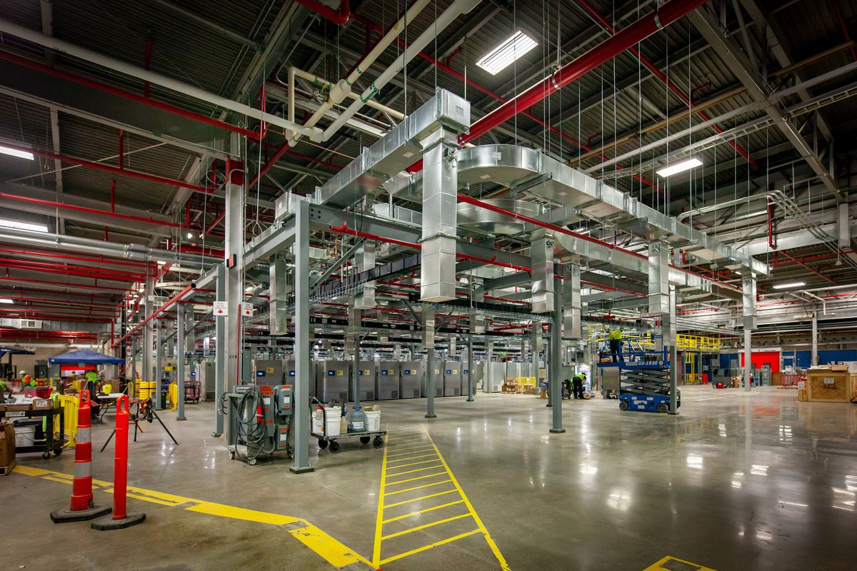 This October 2020 photo provided by Pfizer shows freezers set up in a warehouse in Kalamzoo, Mich., in preparation for distribution of the company