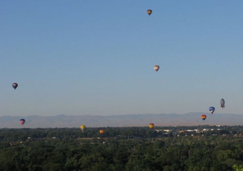 Hot-air balloons float over Boise on Friday morning as part of the 2010 Spirit of Boise Balloon Classic.  (Betsy Russell)