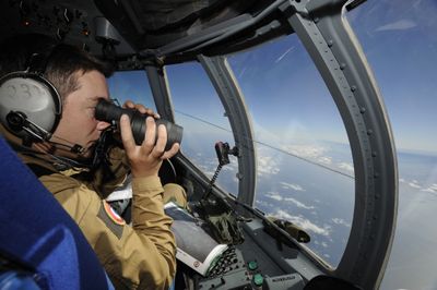 A French army air crewman  patrols the site of the crash Tuesday over the Atlantic Ocean.  (Associated Press / The Spokesman-Review)