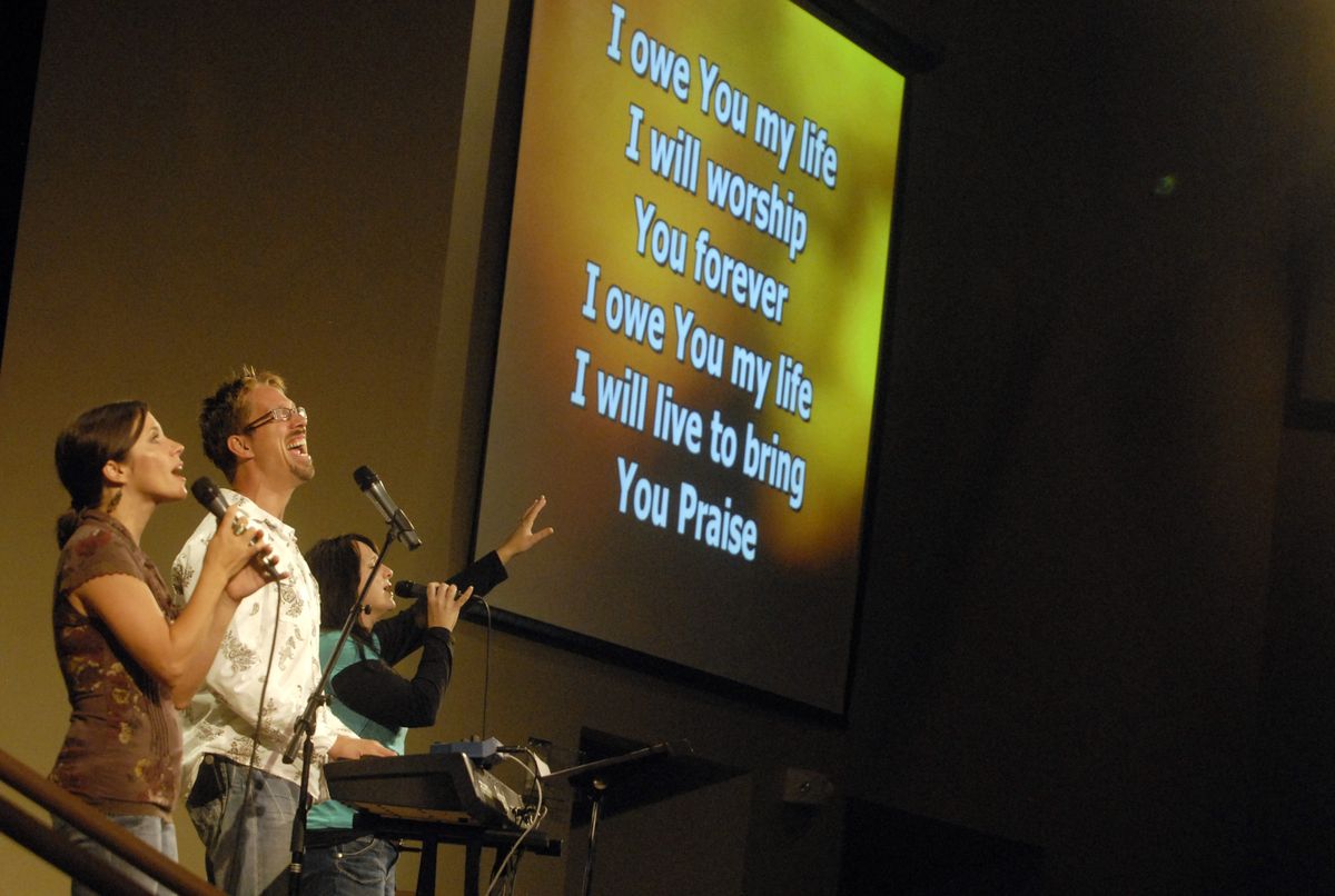 Erik Svendsen leads the Valley Real Life congregation in song during a  Sunday morning service in September. The church recently  moved into its new building at 1831 S. Barker Road in Spokane Valley.  (J, BART RAYNIAK / The Spokesman-Review)