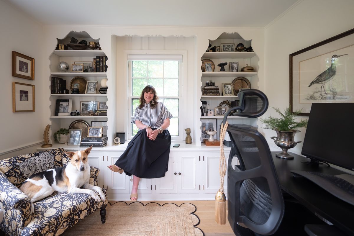 Stylist Katie Howie in her home office with her “pandemic puppy” Chip Wednesday, June 5, 2024 St. Paul, Minn. St. Paul’s Katie Howie is a “slow stylist” with clients that include Mayor Melvin Carter and Lt. Governor Peggy Flanagan. Stylist Katie Howie shows how she layers vintage, new and family heirlooms.  (Star Tribune)