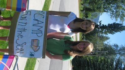 Aubrie Perry, left, and Bailey Scrimsher, both 15, created a weeklong day camp for young girls in their neighborhood as a way to raise money for a trip they plan to take to Uganda.
