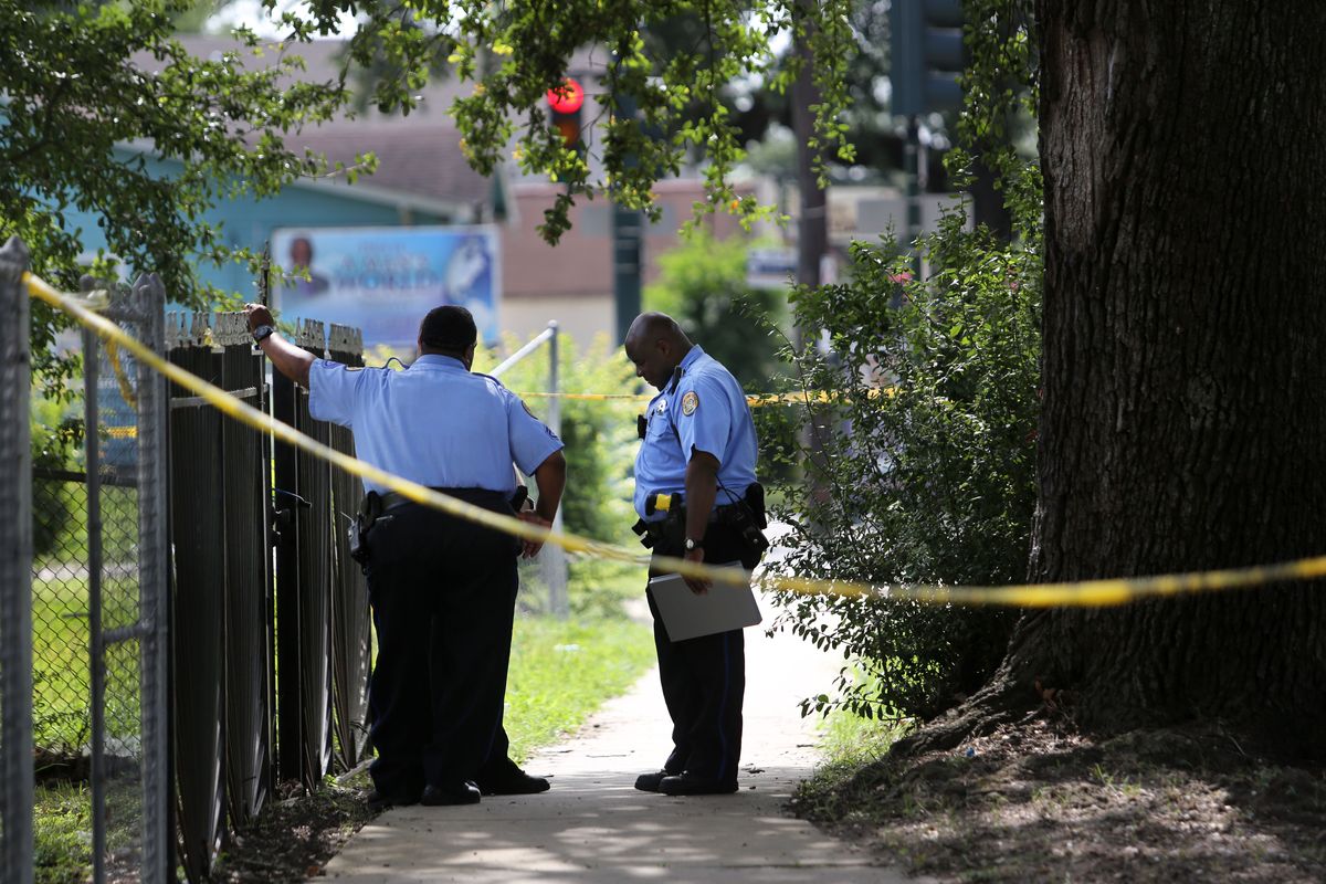 New Orleans Police officers at the scene where police say they caught Travis Boys on Sunday morning. (Associated Press)