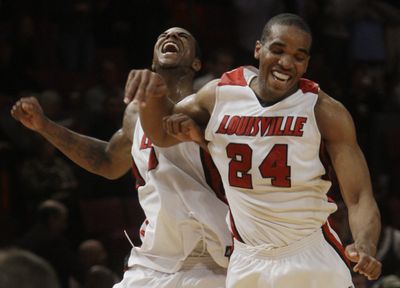 Louisville’s Earl Clark, left, and Samardo Samuels celebrated Big East championship on Saturday and No. 1 overall seeding on Sunday.  (Associated Press / The Spokesman-Review)