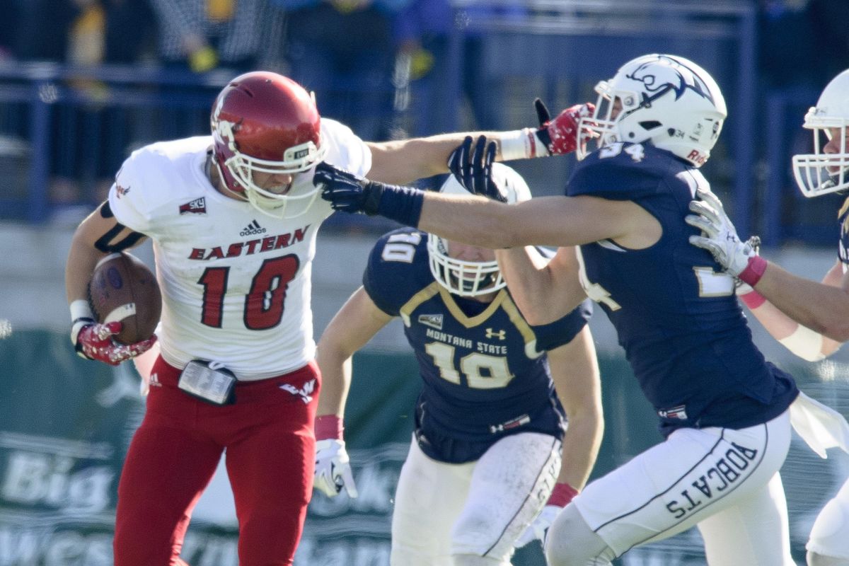 Eastern Washington wide receiver Cooper Kupp, left,  fights off Montana State defenders during the first half of an NCAA college football game Saturday, Oct. 22, 2016 in Bozeman. (Kelly Gorham / Montana State University via AP)