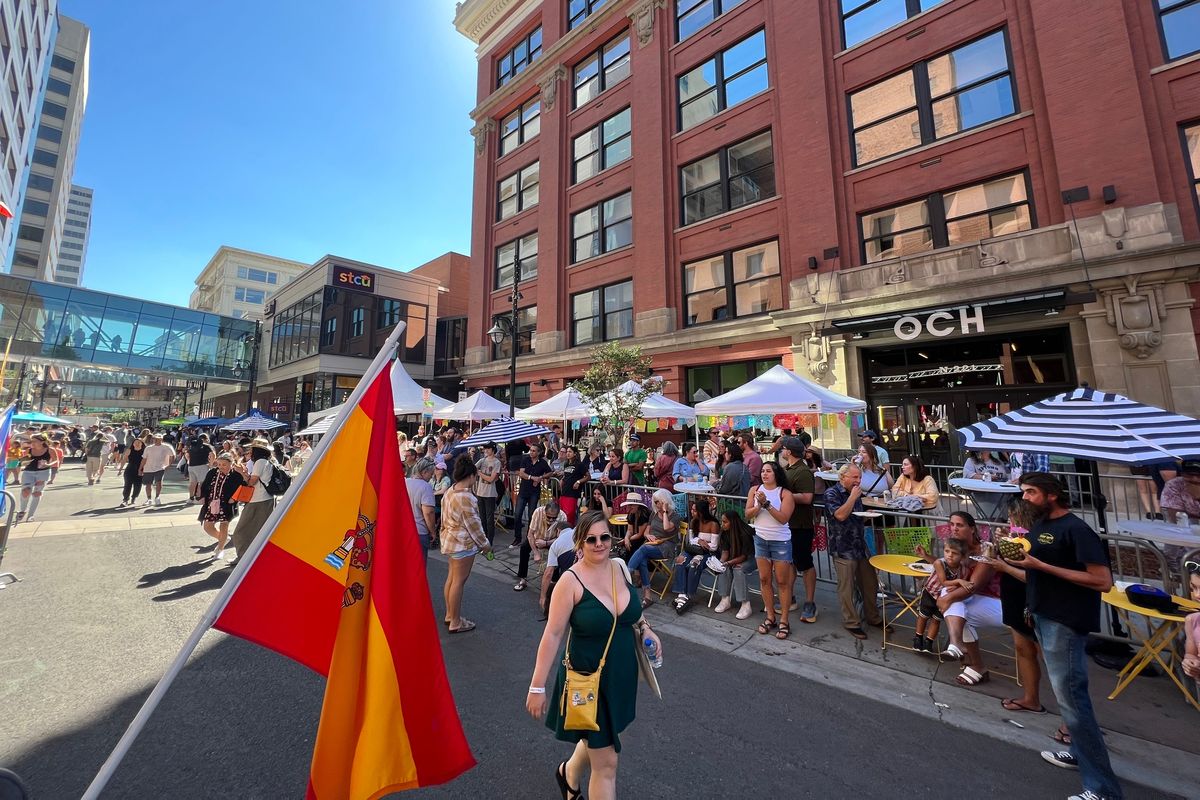 A crowd of people gather along Wall Street to watch a performance at the Tacos y Tequila Festival in downtown Spokane on Sunday.  (Quinn Welsch)