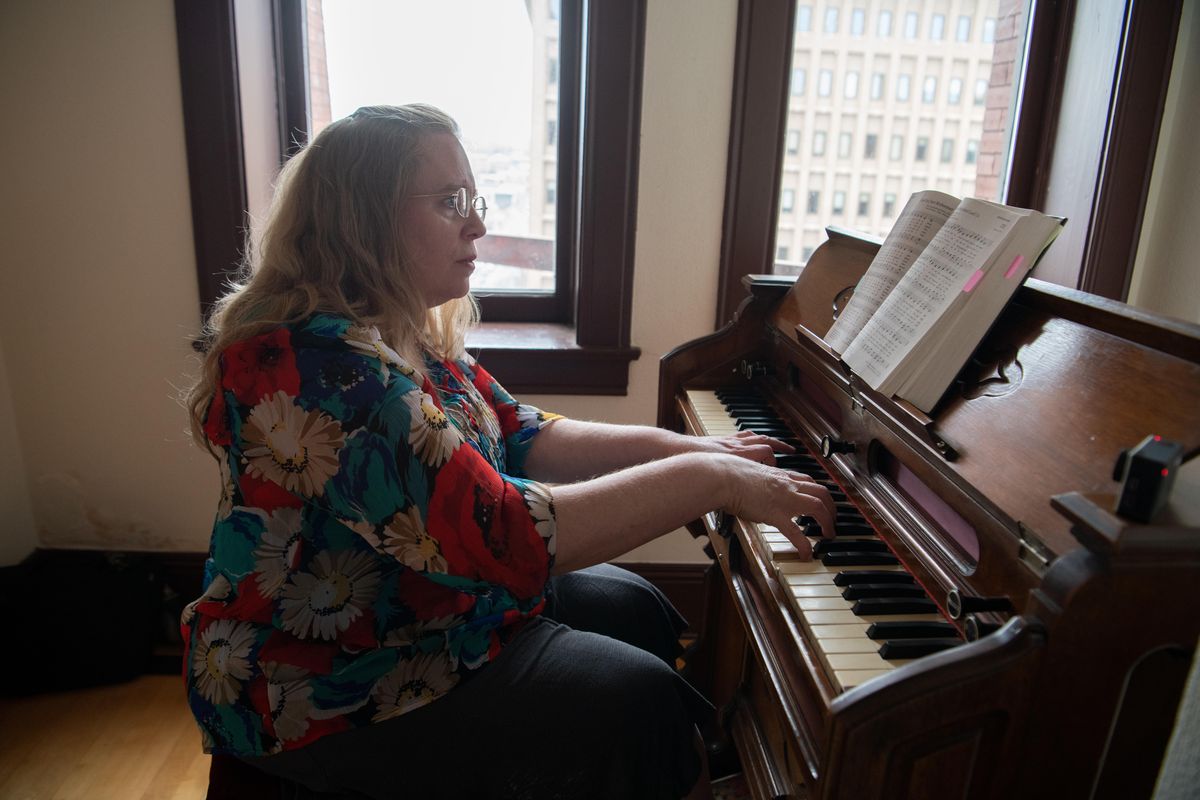 Church musician Janet Hubbard, who plays at Westminster United Church of Christ, plays the antique pump organ in the tower of the Review Tower Friday, April 19, 2019. Hubbard wrote a hymn celebrating the 140th anniversary of the congregation. (Jesse Tinsley / The Spokesman-Review)