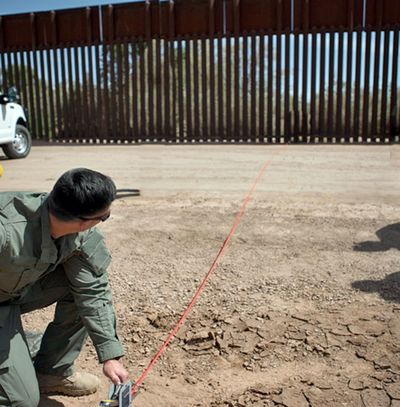 In this April 14, 2016, file photo provided by U.S. Customs and Border Protection, a Border Patrol agent shows the path of a tunnel that crosses the U.S.-Mexico border near Calexico, Calif. (Associated Press)
